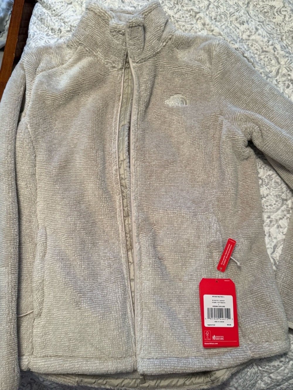 The North Face Cream Sherpa Fleece with Black Logo Tag